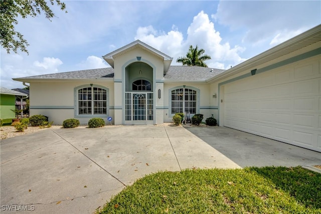 ranch-style house featuring a garage