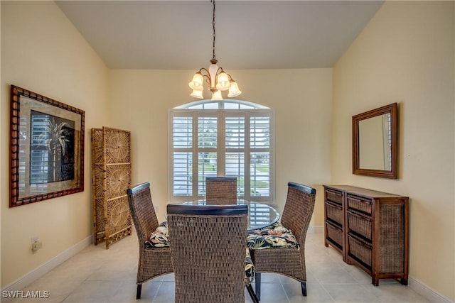 tiled dining space featuring an inviting chandelier