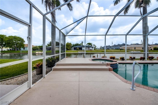 view of pool featuring an in ground hot tub, a water view, and glass enclosure