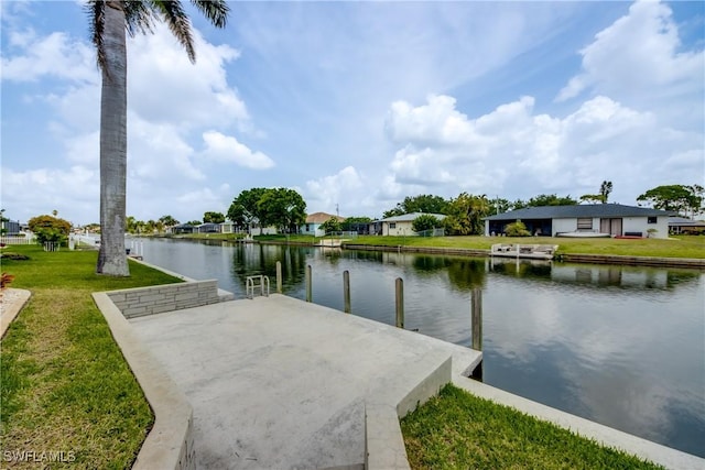 dock area featuring a yard and a water view