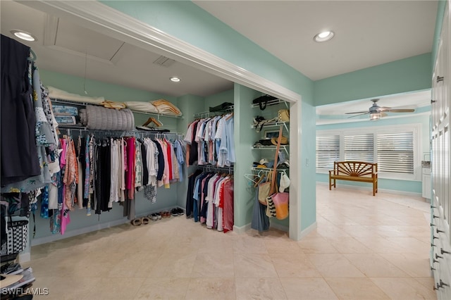 spacious closet with ceiling fan