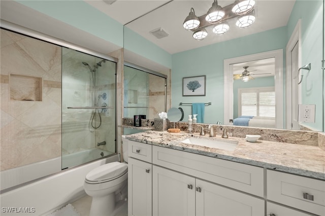 full bathroom with vanity, toilet, ceiling fan, and enclosed tub / shower combo