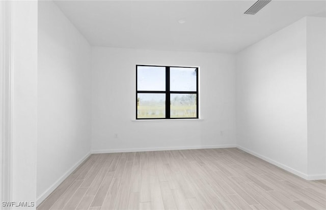 empty room with light hardwood / wood-style floors