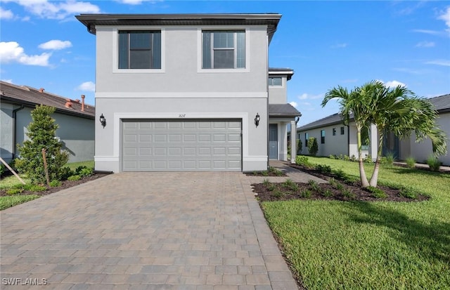 view of front facade featuring a front lawn and a garage