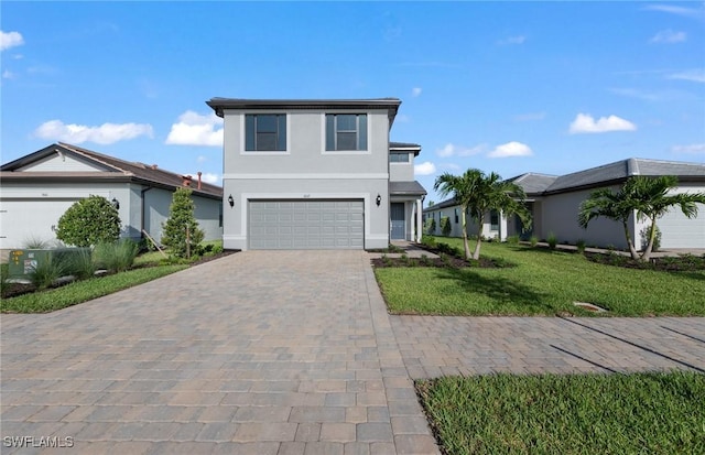 view of front facade with a front yard and a garage