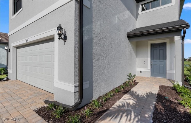 property entrance with a garage