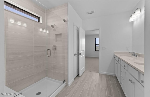 bathroom with vanity and walk in shower