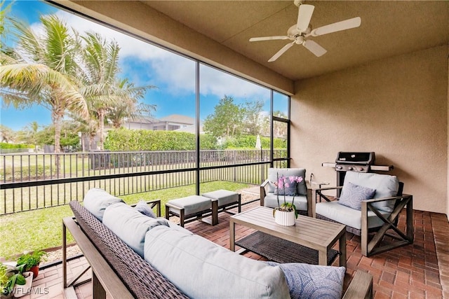 sunroom with ceiling fan