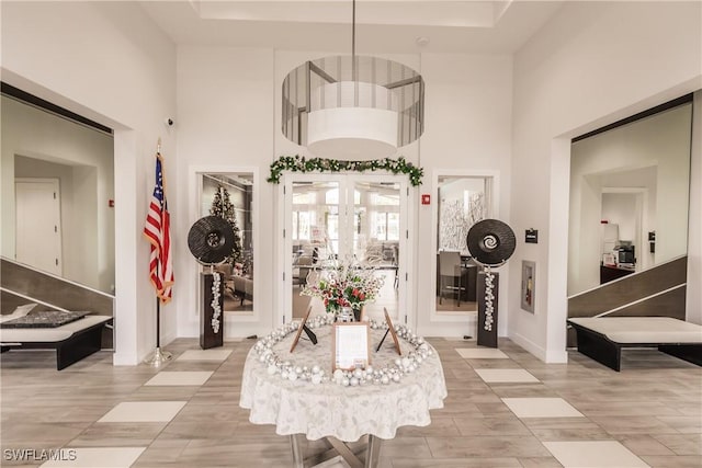 entrance foyer featuring a towering ceiling