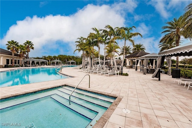 view of swimming pool featuring a patio area