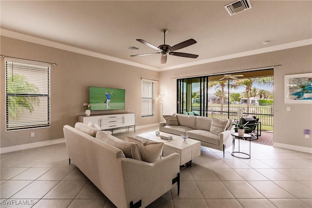 tiled living room featuring ceiling fan and ornamental molding