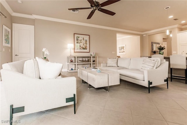 living room with ceiling fan, tile patterned flooring, and ornamental molding