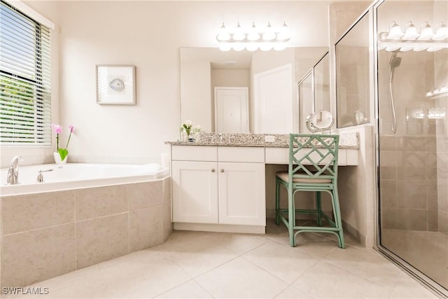 bathroom with tile patterned floors, vanity, and plus walk in shower