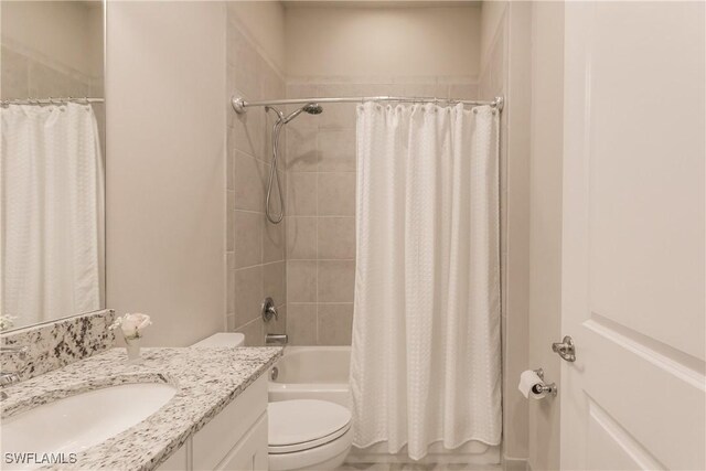 full bathroom featuring vanity, toilet, and shower / tub combo with curtain