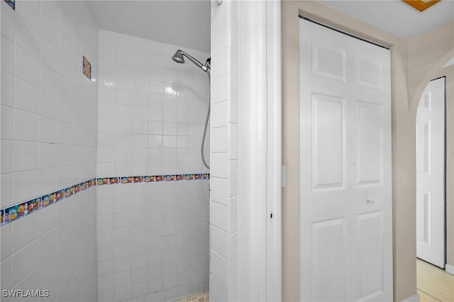 bathroom with tiled shower