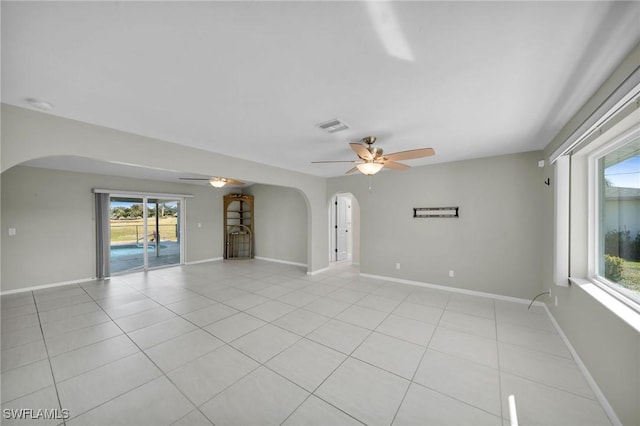 unfurnished room featuring light tile patterned floors and ceiling fan