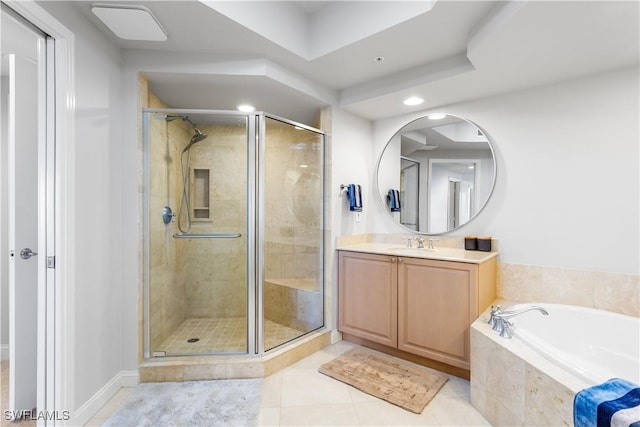 bathroom with tile patterned flooring, vanity, and shower with separate bathtub