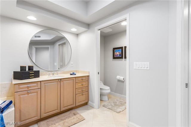 bathroom with tile patterned floors, vanity, and toilet