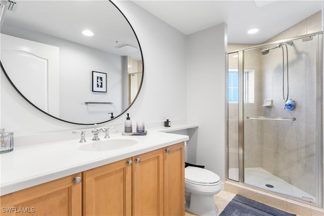 bathroom with vanity, toilet, and walk in shower