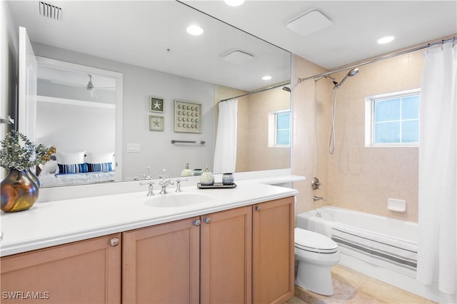 full bathroom with tile patterned flooring, shower / bath combo, vanity, and toilet