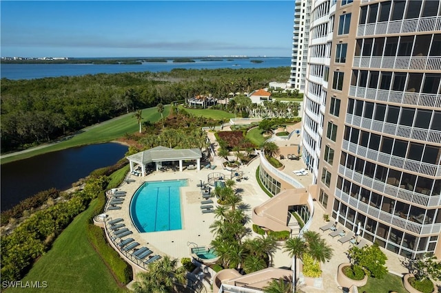 view of swimming pool featuring a water view