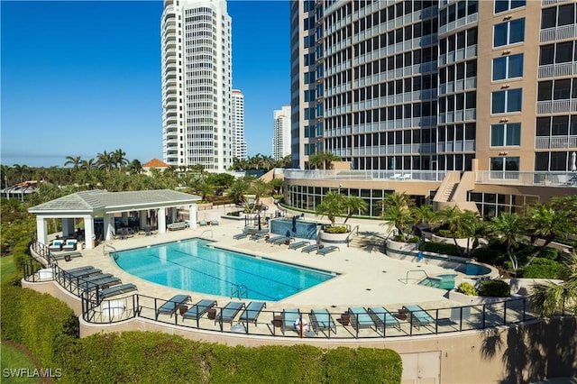 view of swimming pool with a gazebo and a patio area