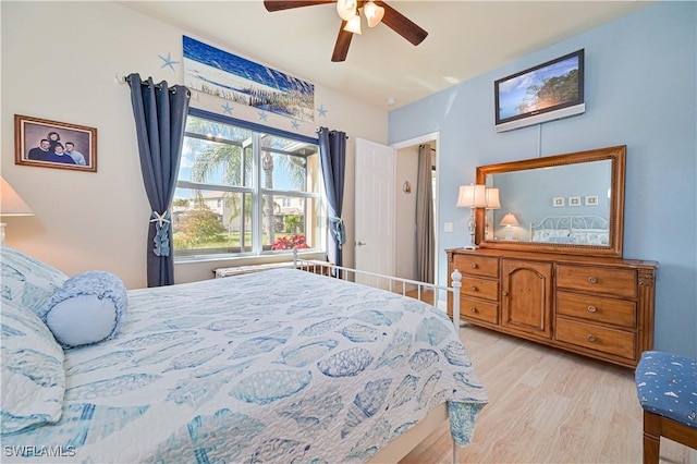 bedroom with ceiling fan and light wood-type flooring