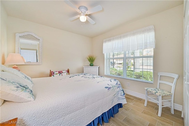 bedroom featuring ceiling fan and light hardwood / wood-style flooring