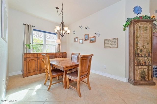 dining room featuring light tile patterned floors and an inviting chandelier