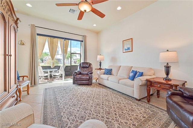 tiled living room featuring ceiling fan