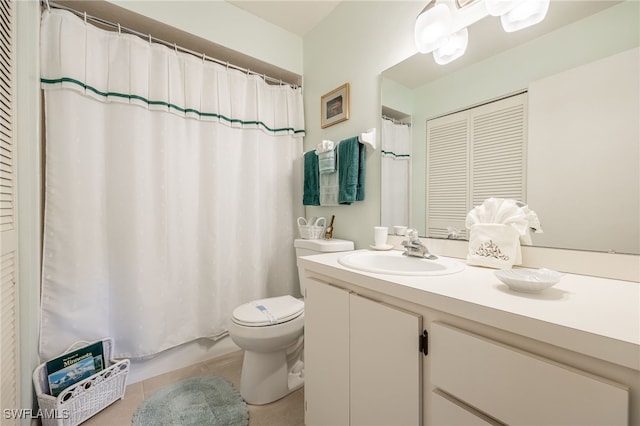 bathroom featuring tile patterned floors, vanity, curtained shower, and toilet