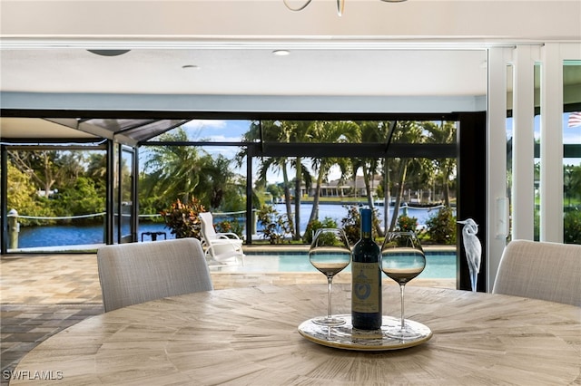 dining space featuring a water view