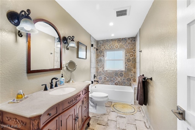 bathroom featuring bathing tub / shower combination, visible vents, a textured wall, toilet, and vanity