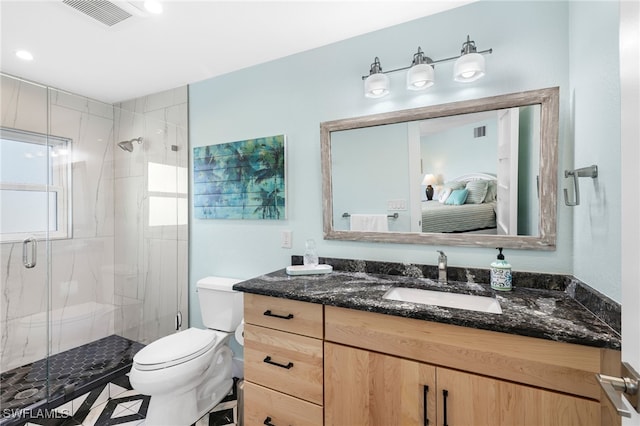 bathroom with a marble finish shower, vanity, visible vents, and ensuite bathroom