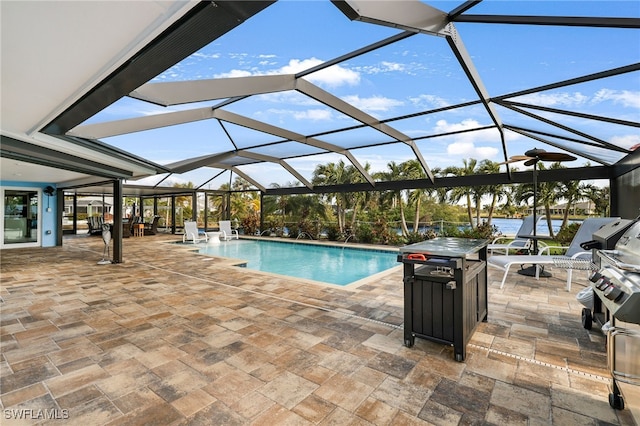 outdoor pool with a lanai and a patio