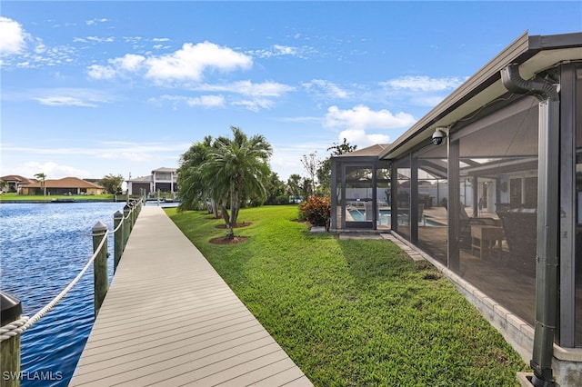 dock area featuring a lawn, a water view, a lanai, and an outdoor pool