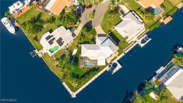 drone / aerial view with a water view and a residential view