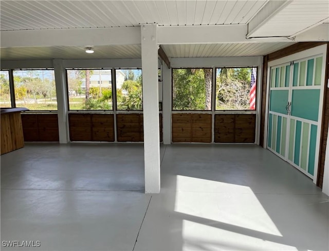 unfurnished sunroom with a wealth of natural light