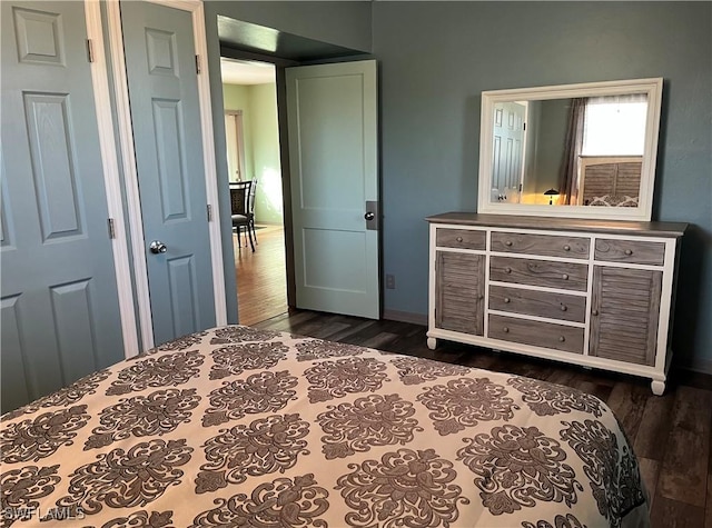 bedroom featuring dark wood-type flooring