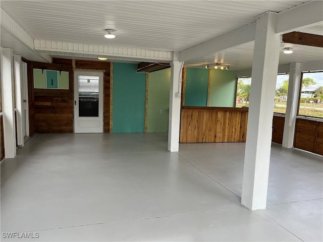 interior space featuring wooden walls