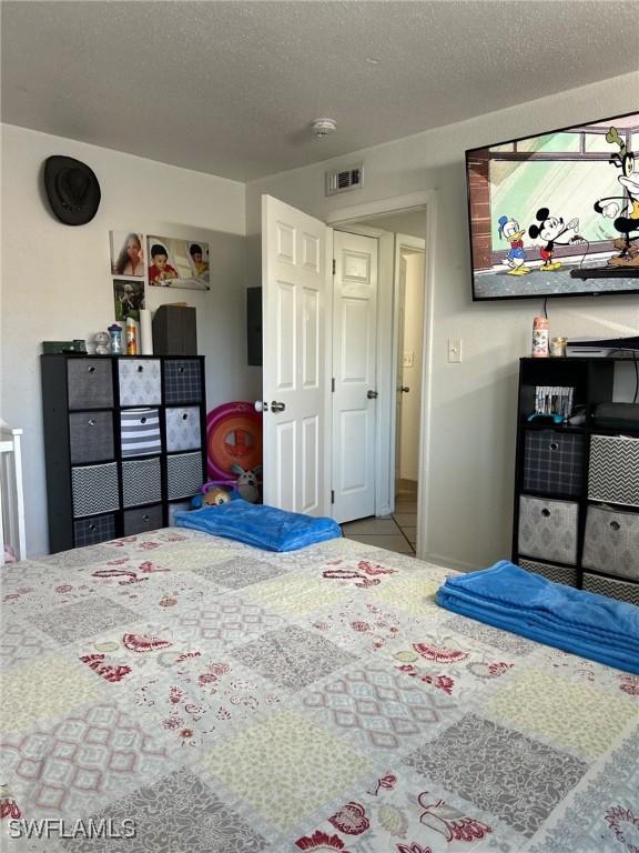 bedroom with a textured ceiling