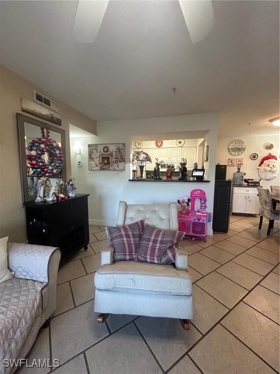 living room with tile patterned floors