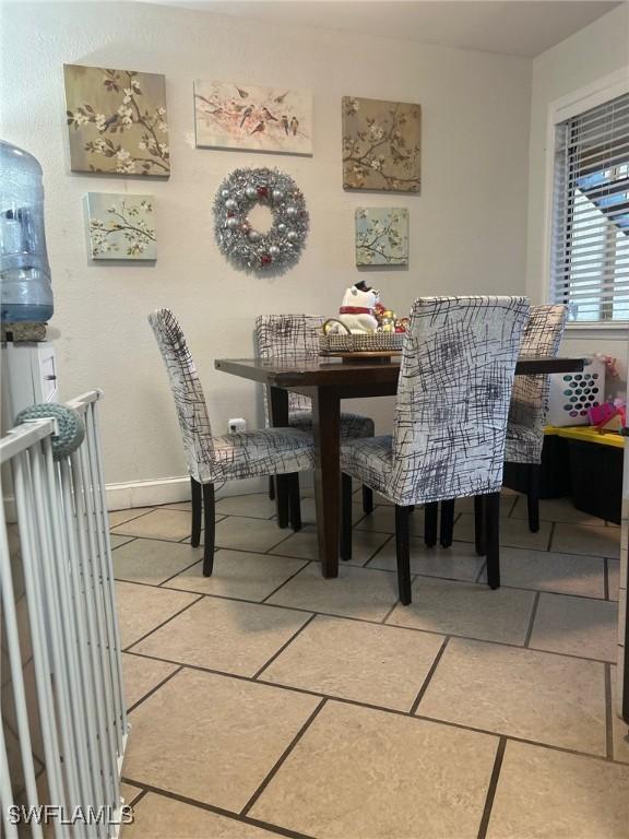 dining room featuring tile patterned flooring