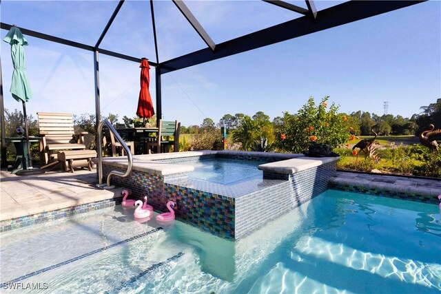 view of pool featuring glass enclosure and a patio area