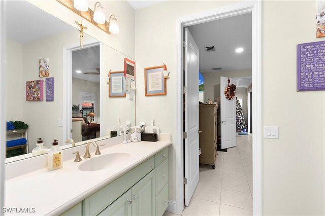 bathroom featuring tile patterned flooring and vanity