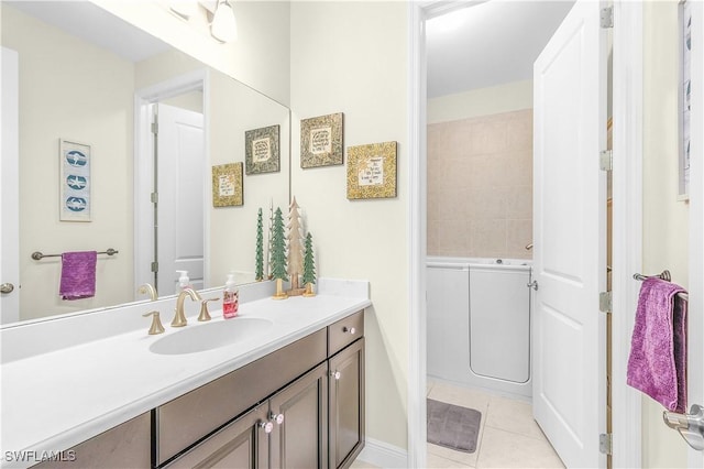 bathroom featuring tile patterned flooring and vanity