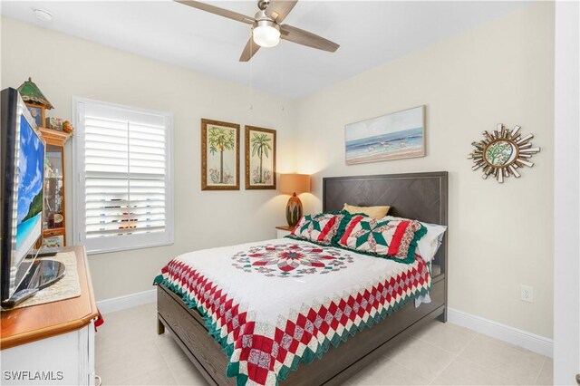 tiled bedroom with ceiling fan