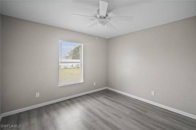 spare room with ceiling fan and hardwood / wood-style floors