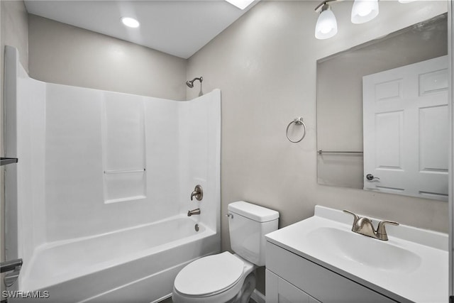 full bathroom with bathing tub / shower combination, vanity, and toilet