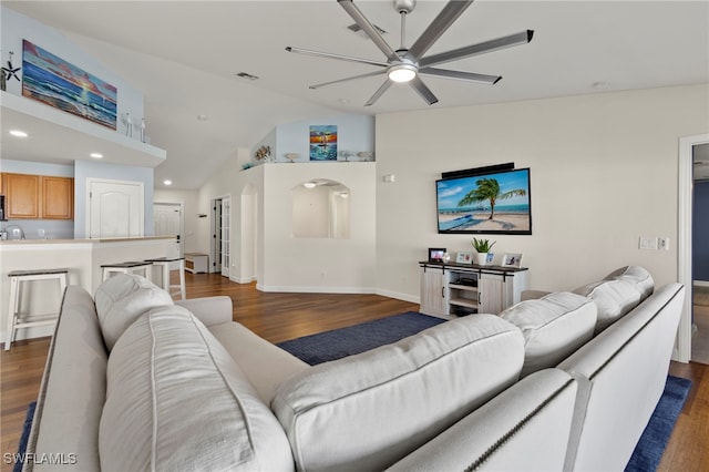 living area with vaulted ceiling, dark wood finished floors, visible vents, and recessed lighting